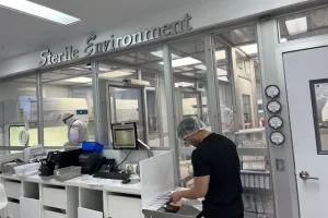 a tech working in a sterile environment