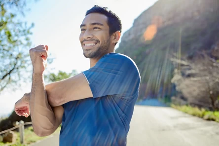 A man stretching his arm muscles