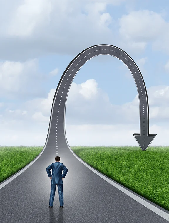 A graphic of a man staring down a road with a downturn representing erectile dysfunction